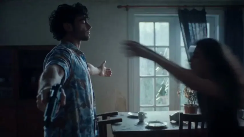 The couple embracing in the cold zombie scene